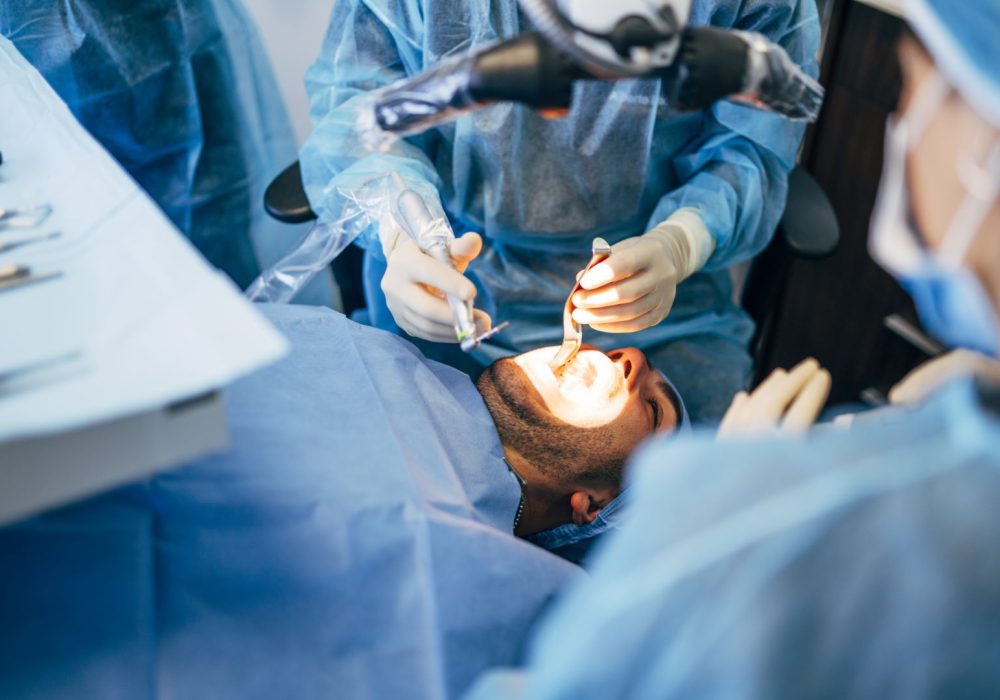 Team dental surgeons working in dental clinic.